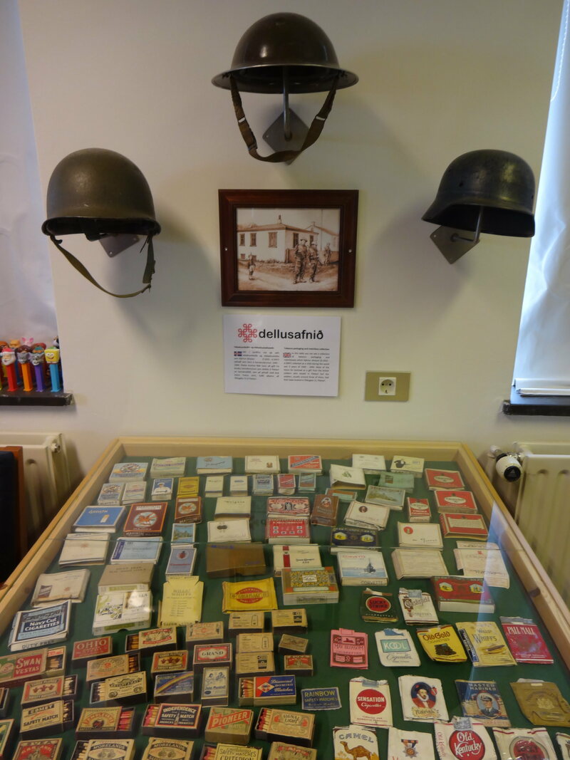 Tobacco packaging, matchbooks, Pez dispensers, and helmets at the Nonsense Museum in Flateyri. COURTESY A. KENDRA GREENE